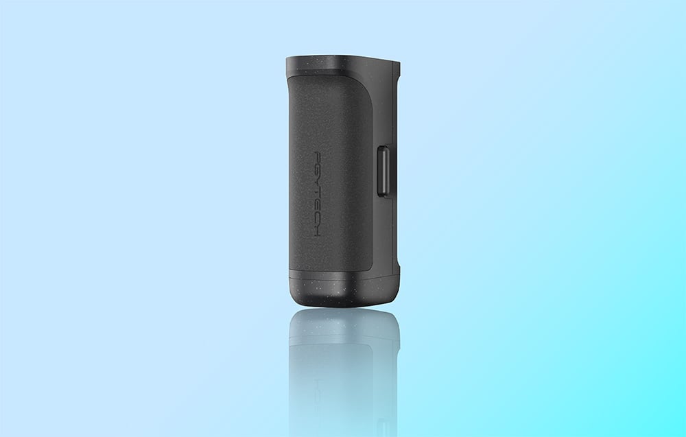 Gray cylindrical PGYTECH device with reflections on glossy surface on blue background