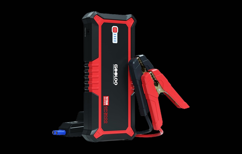 Car jump starter with clamps connected on a black background