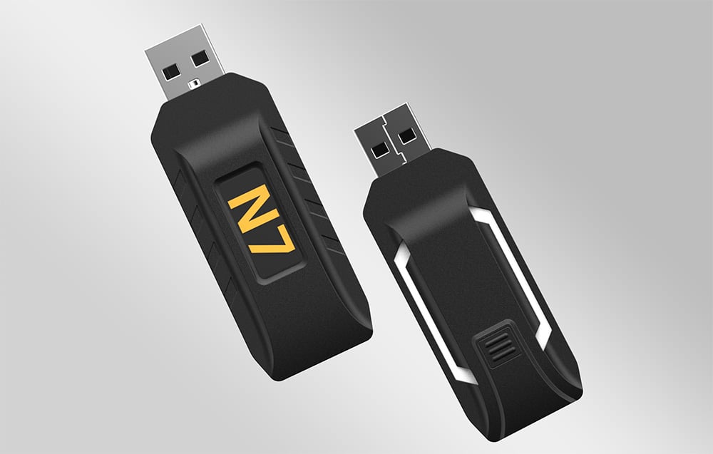 Two black PXN N7 USB adapters on a gray background