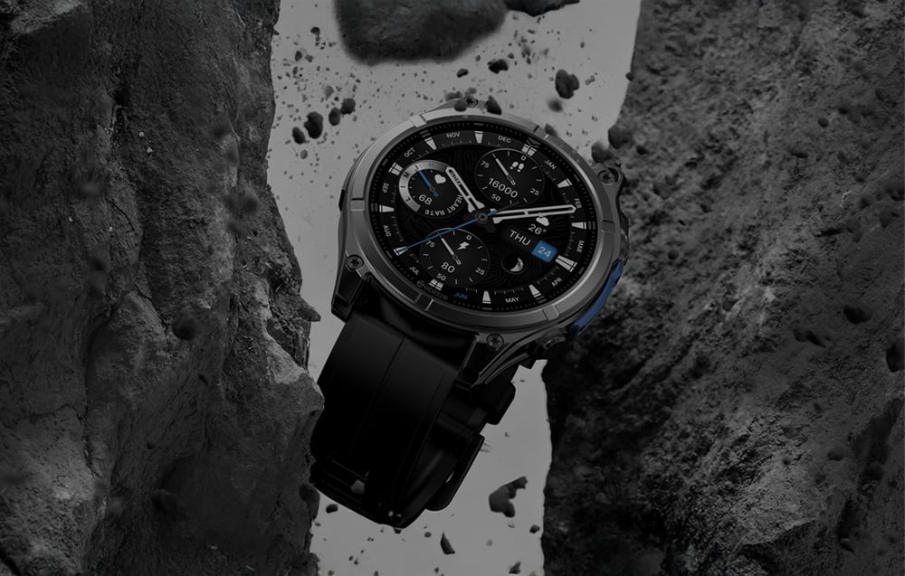Black smartwatch with multifunction dial set on a wet surface between rocks