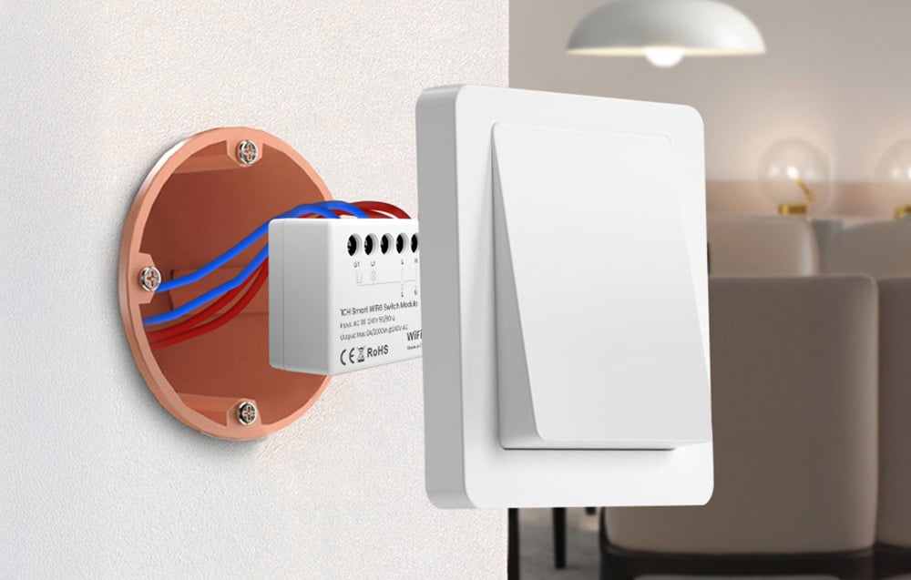Smart switch module mounted in a box behind a wall light switch