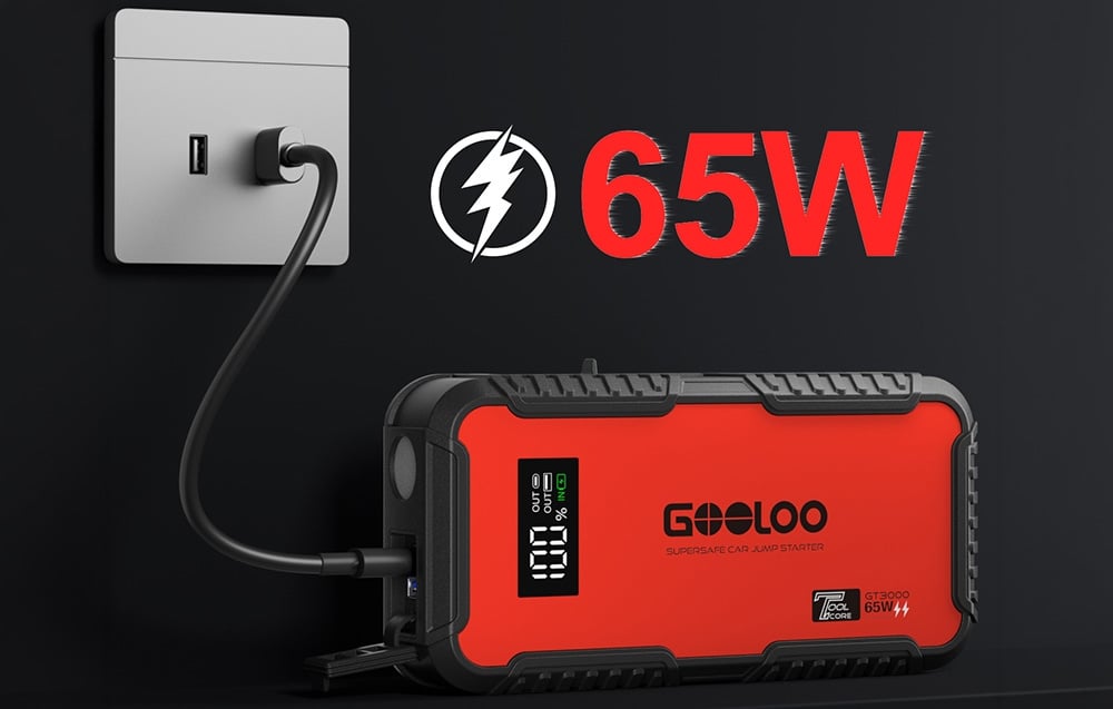 Car starter plugged into a wall outlet labeled 65W