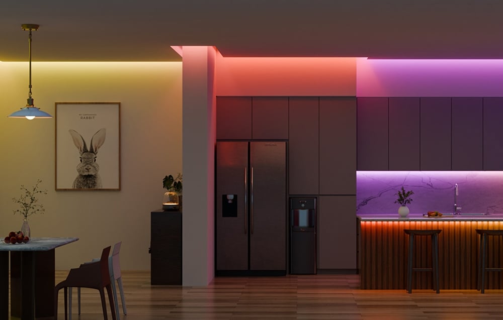 Kitchen with dining area lit by colored LED strips