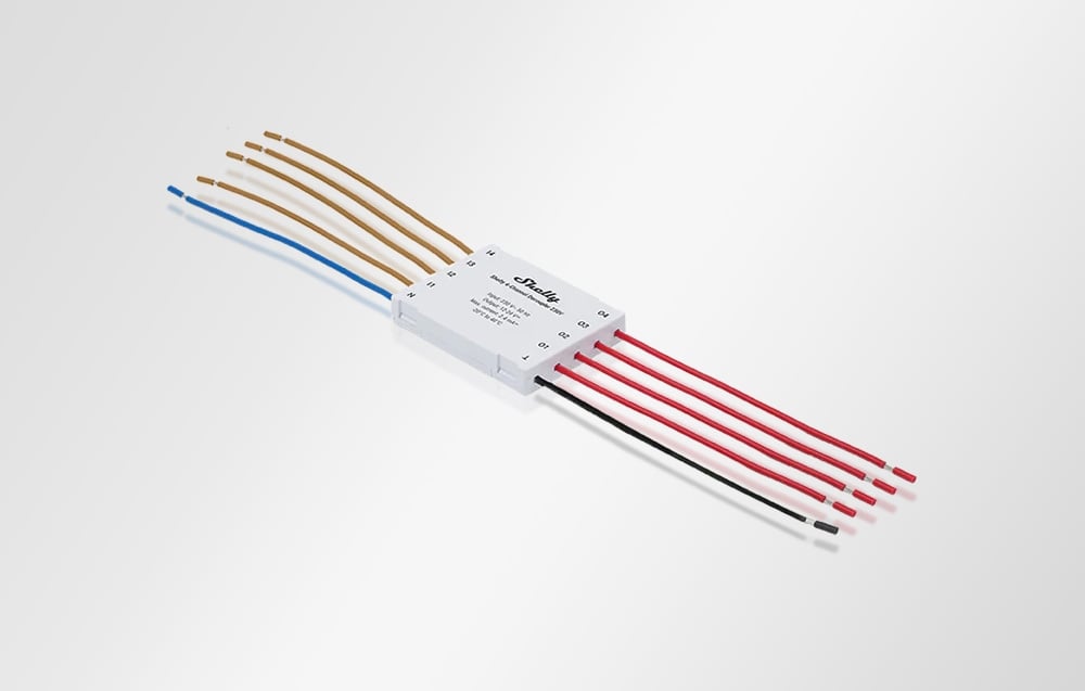 Perspective view of Shelly 4-Channel Decoupler module with brown and red wires on a white background