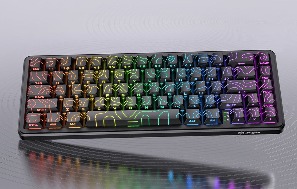 Gaming keyboard with rainbow RGB backlighting on a light background with reflections