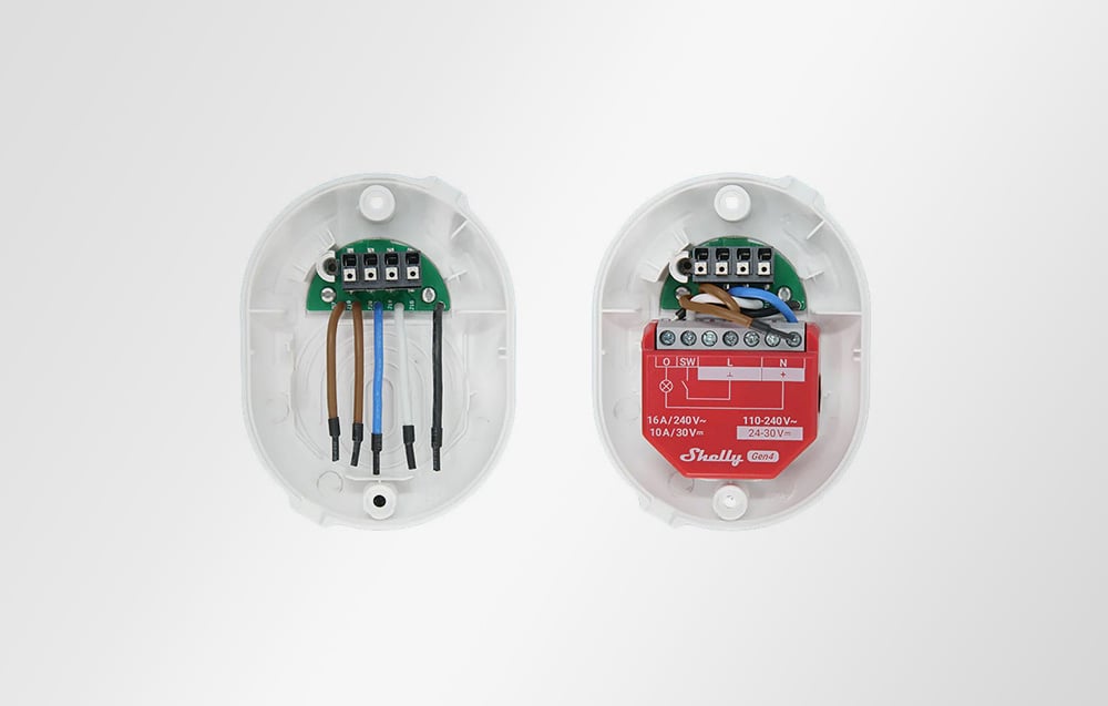 The inside of the white Shelly Button Add-on accessory with connectors and wires connected visible.