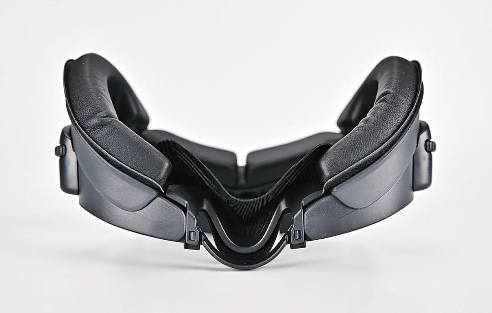 Black face pad lying on a white background