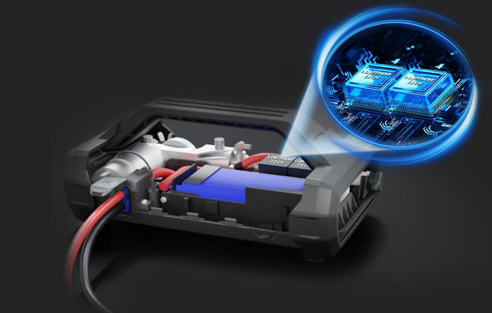 A cross-section of the jump starter’s interior showing a blue battery and two illuminated integrated circuits.
