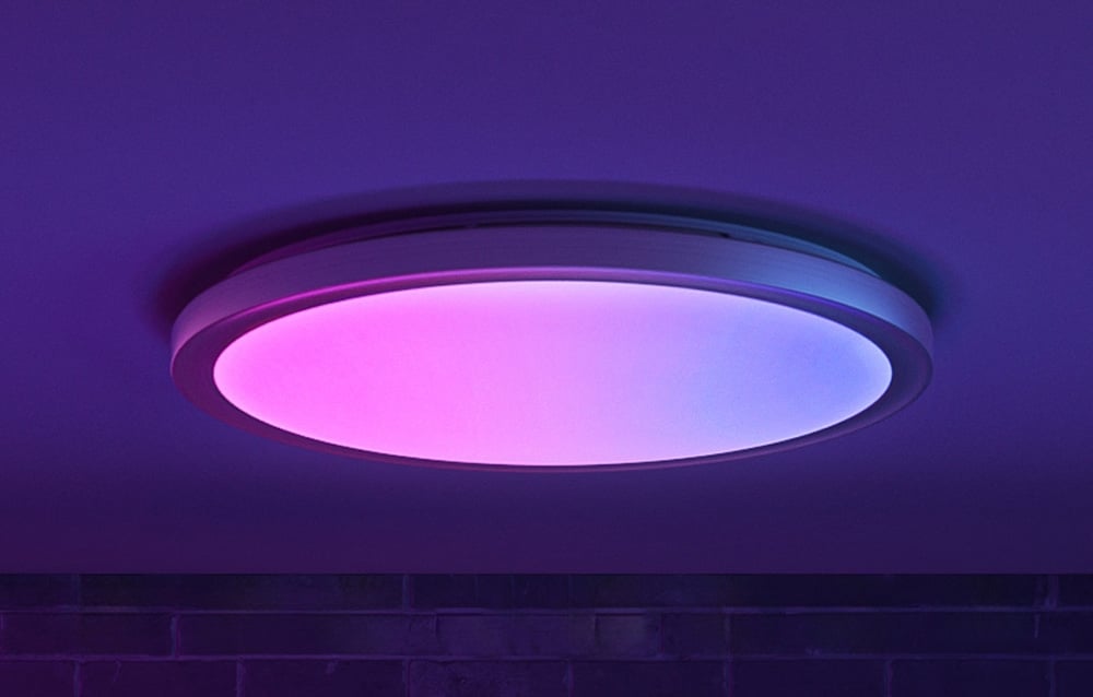 Close-up of the Yeelight Jupiter D C400 lamp emitting pink and blue light.