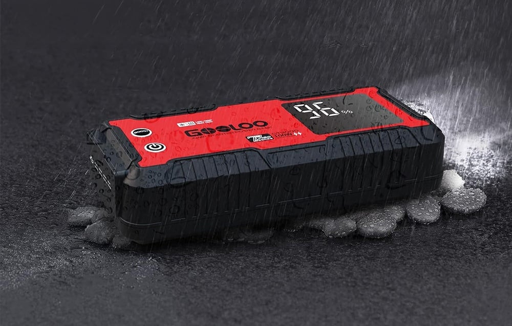 Car starter lying on a wet surface during rain