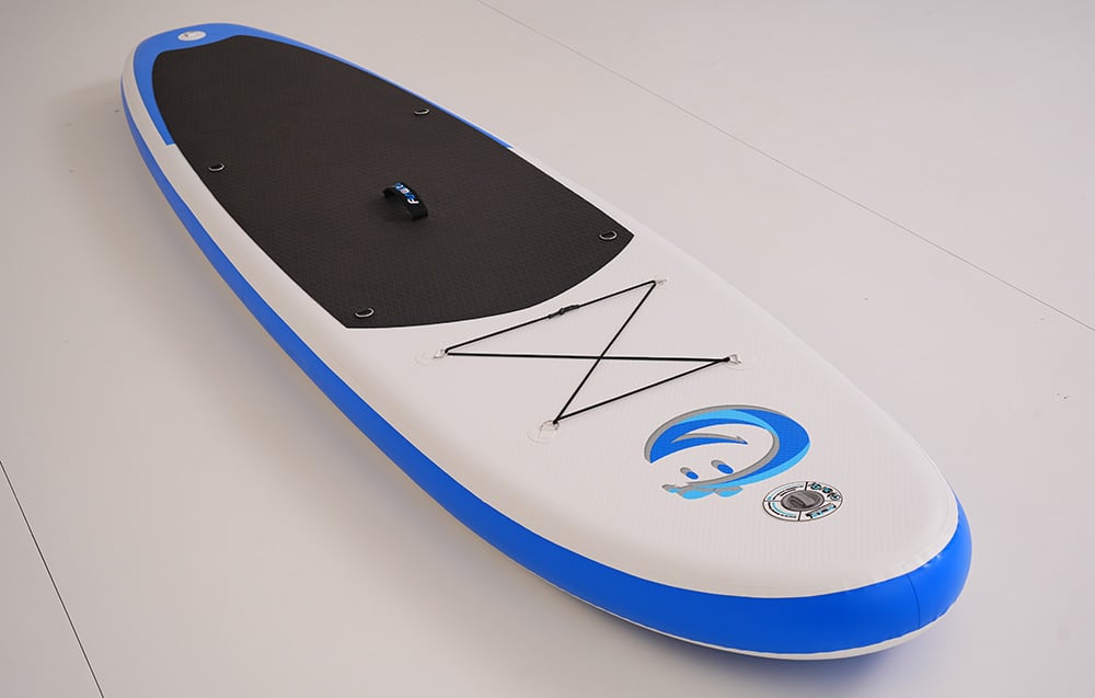 Colorful surfboard with backpack straps on a light background