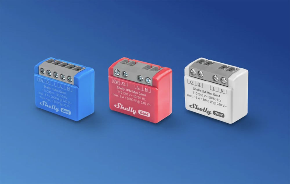 Blue, red, and white controllers side by side on a light blue background.