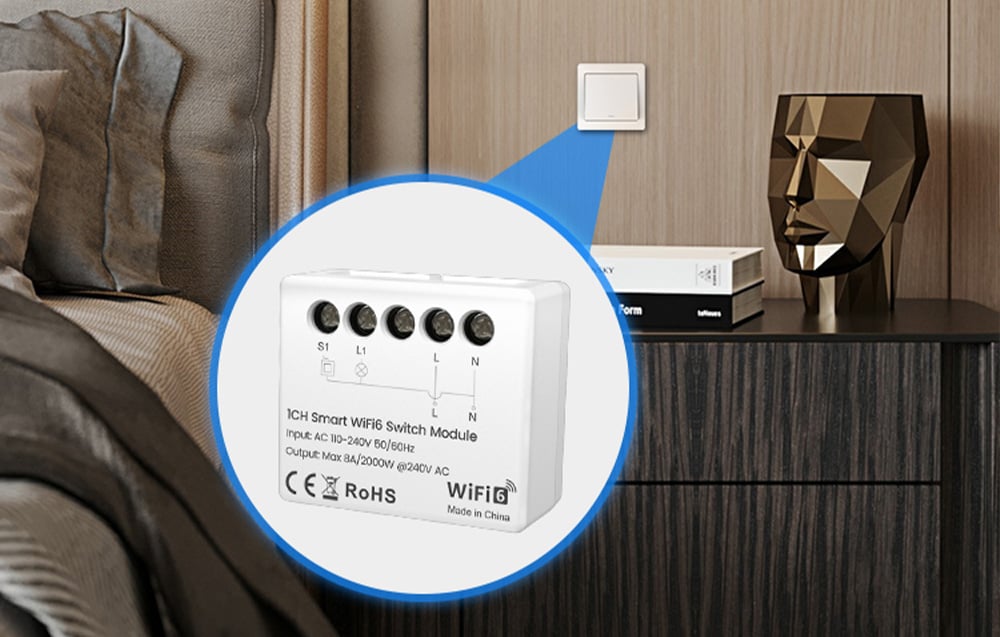 Smart switch module close-up against the background of a bedside switch