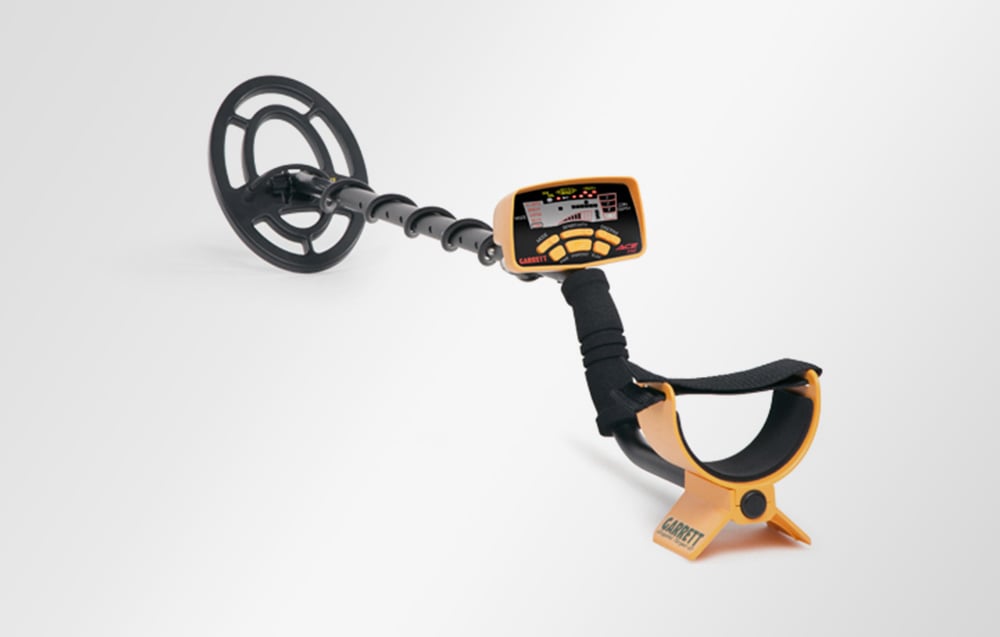 Garrett ACE 250 metal detector on white background, side view.