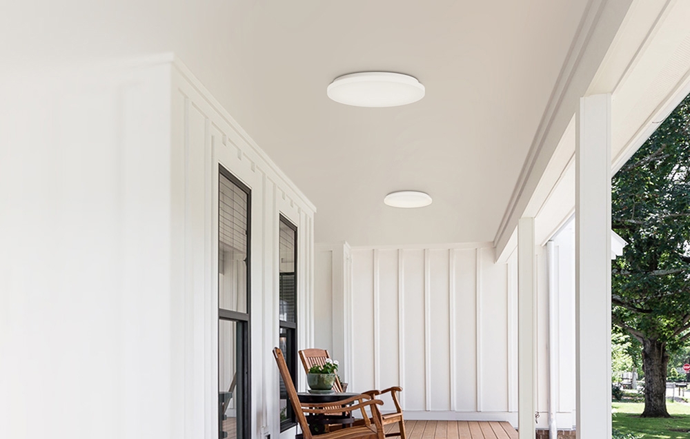 Two Yeelight MercuryE C260 ceiling lamps mounted on a covered porch with a wooden floor and rocking chair.
