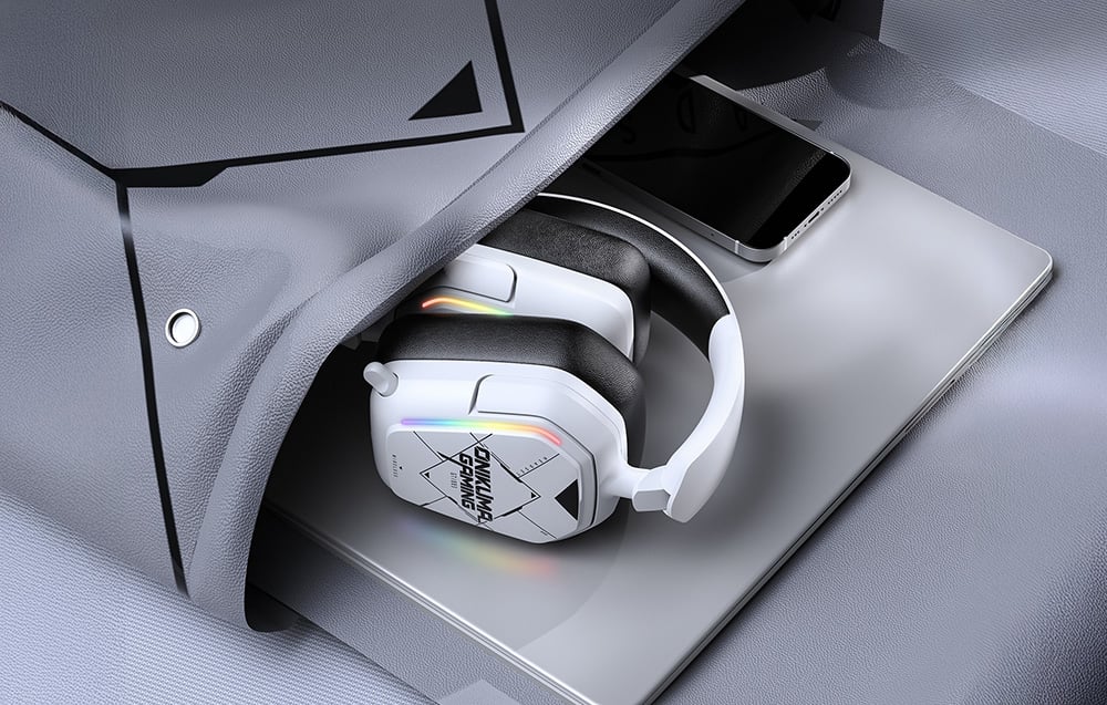 In-ear headphones in a bag together with a laptop and smartphone