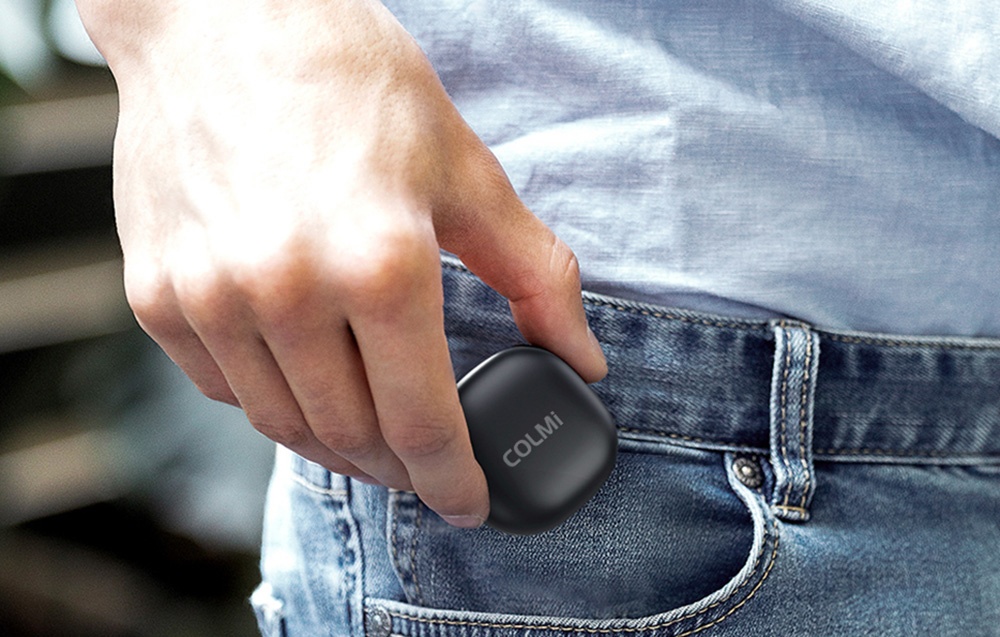 Woman puts Colmi charging case in her pants pocket.