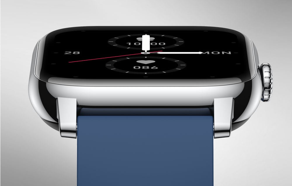 Close-up of the shiny metal smartwatch case with a crown and a navy blue strap