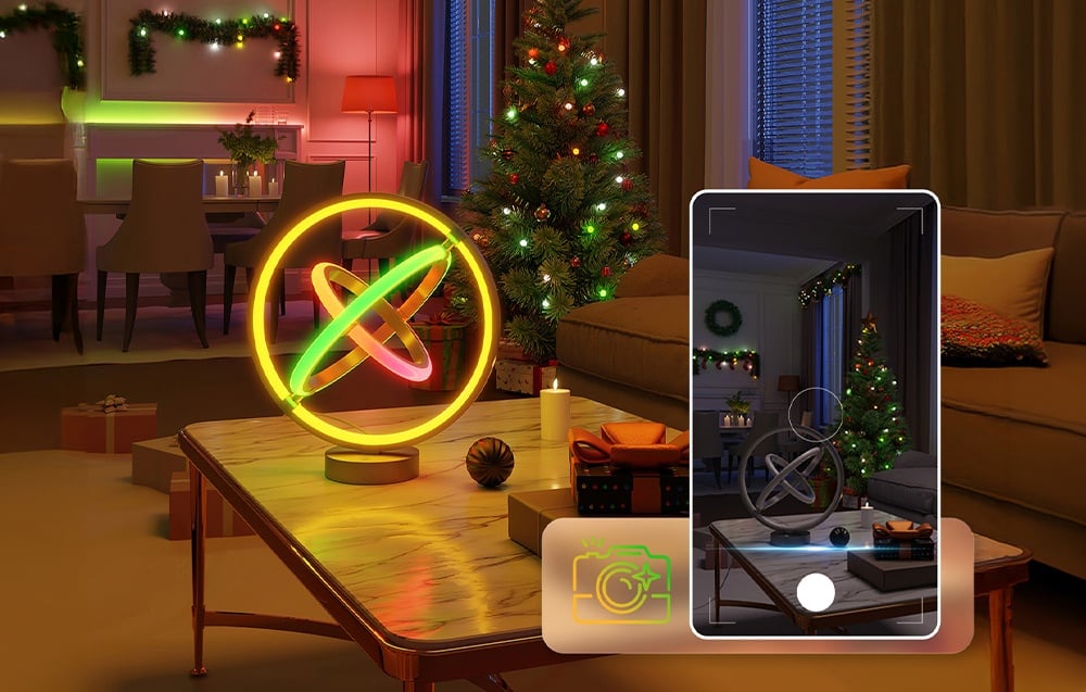 A festive living room with a Christmas tree and a colorful desk lamp on the table, with a smartphone visible taking a photo.