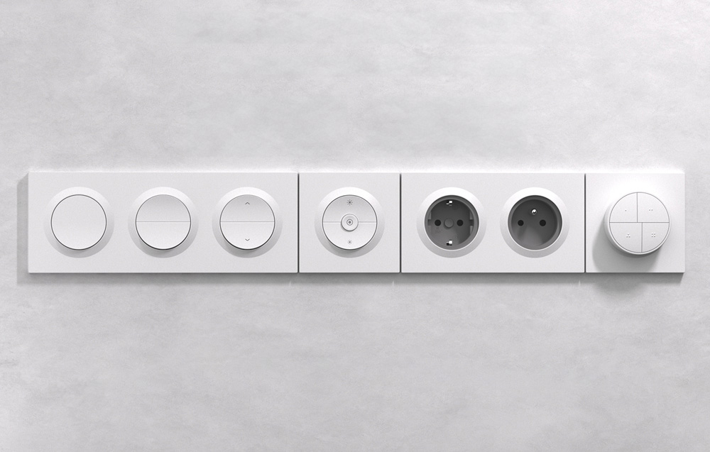 A set of modular elements of the SONOFF system - single and double channel switches, dimmer, sockets and control panel arranged in one row