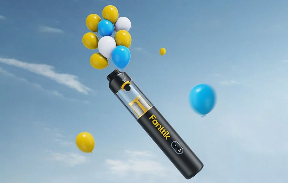 Fanttik cordless car vacuum cleaner against a background of colorful balloons and blue sky.