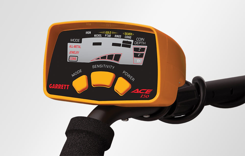 Close-up of the control panel of the Garrett ACE 150 metal detector with three buttons.