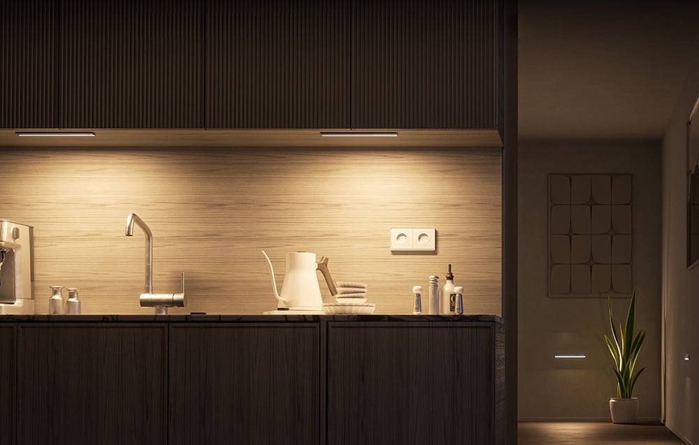 Two Yeelight closet lights mounted under the kitchen cabinets illuminating the countertop.