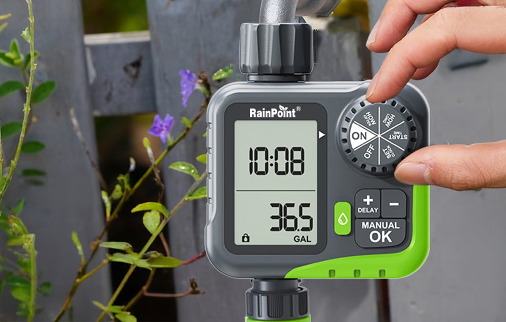 Close-up of a hand setting watering parameters using a rotary knob on the RainPoint controller panel