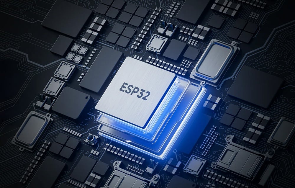 Close-up of ESP52 chip on PCB with blue backlight, electronic components in background
