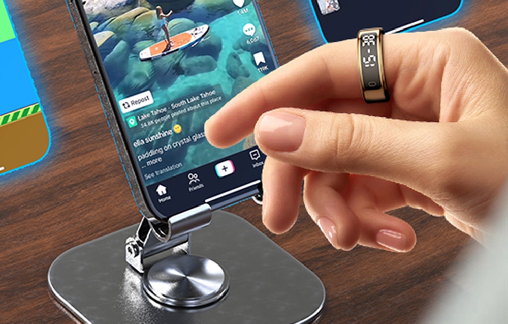 Smartphone with app enabled and hand with smartring.