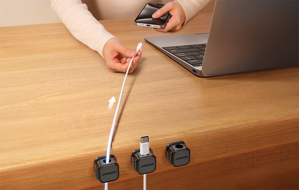 Hand-held cable placed in Joyroom cable organizer