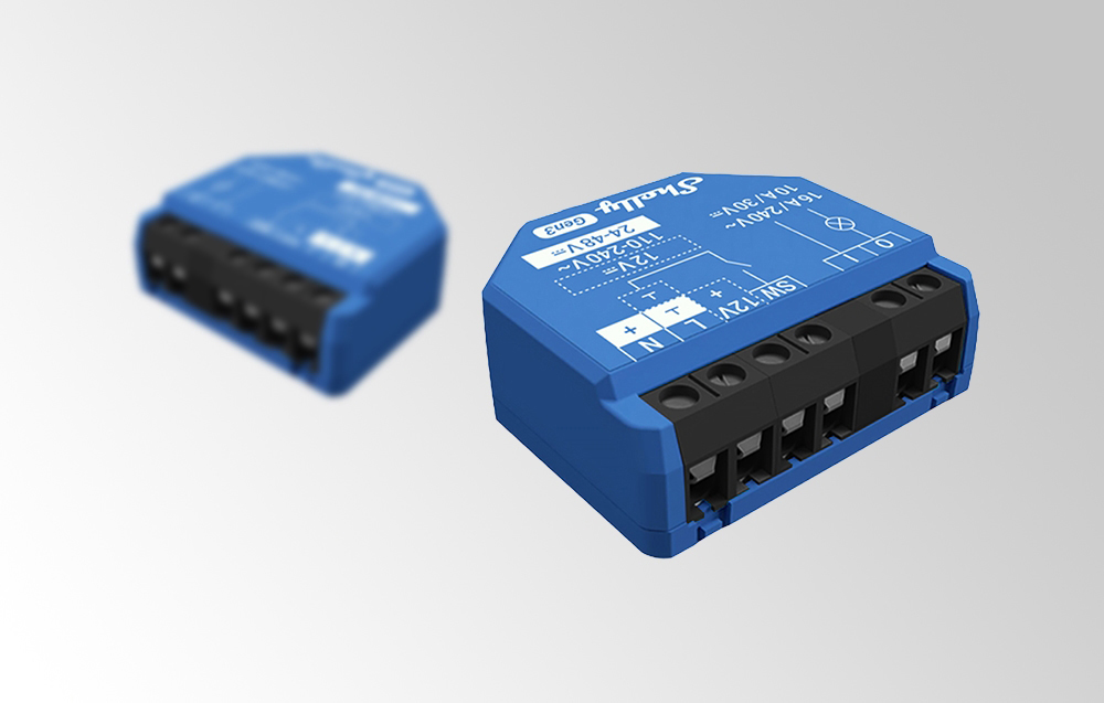 Two Shelly Gen3 modules on a gray background, with one sharp in the foreground and the other blurred in the background