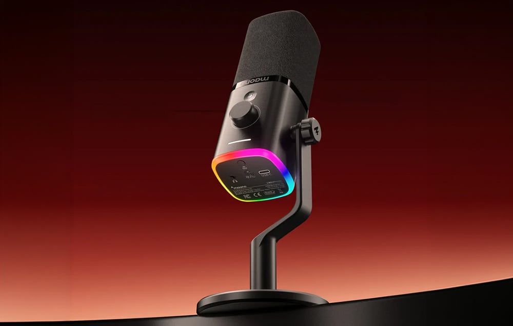 A black Maono microphone on a desktop stand, illuminated from below by a colorful RGB ring