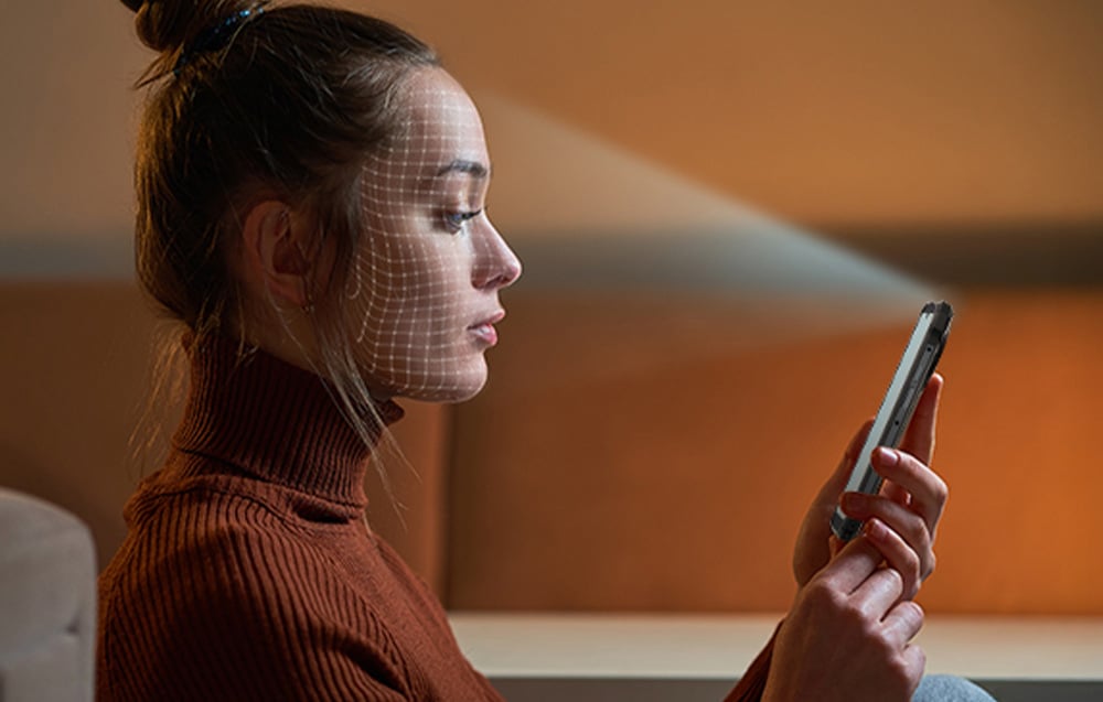 Woman scanning her face with a Hotwav smartphone