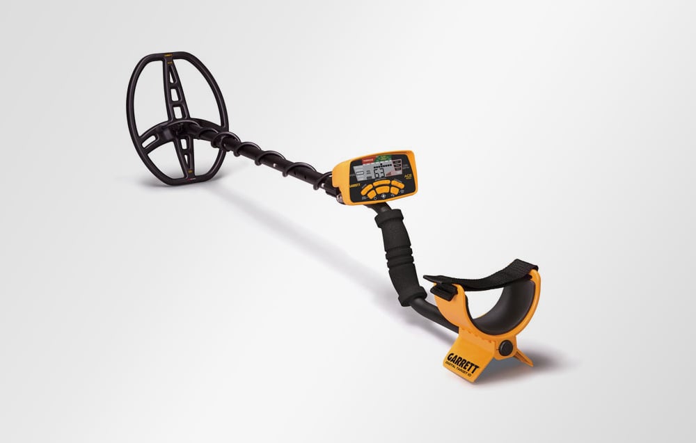 Garrett ACE 400i metal detector lying on a white background in full view.