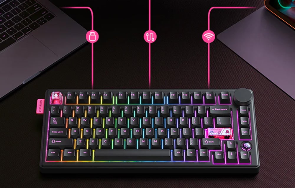 Black keyboard on table next to laptop and tablet