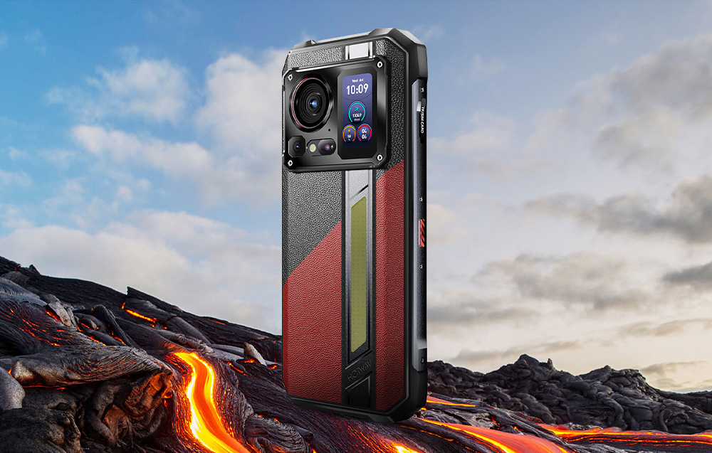 Red and black HOTWAV smartphone shown against a mountainous backdrop with a river of fire.