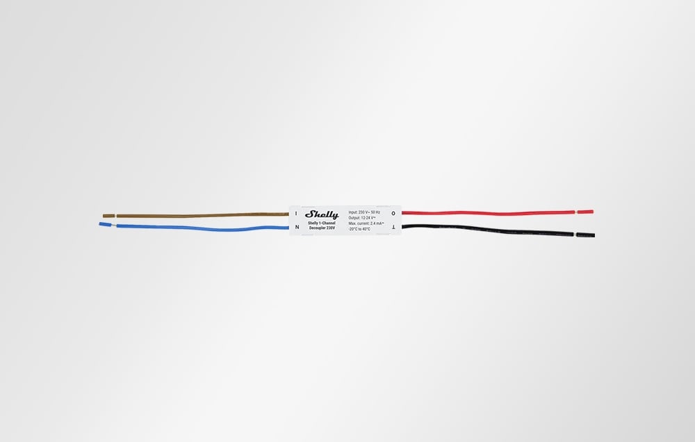 Shelly 1-Channel Decoupler module with four wires laid out on a white background