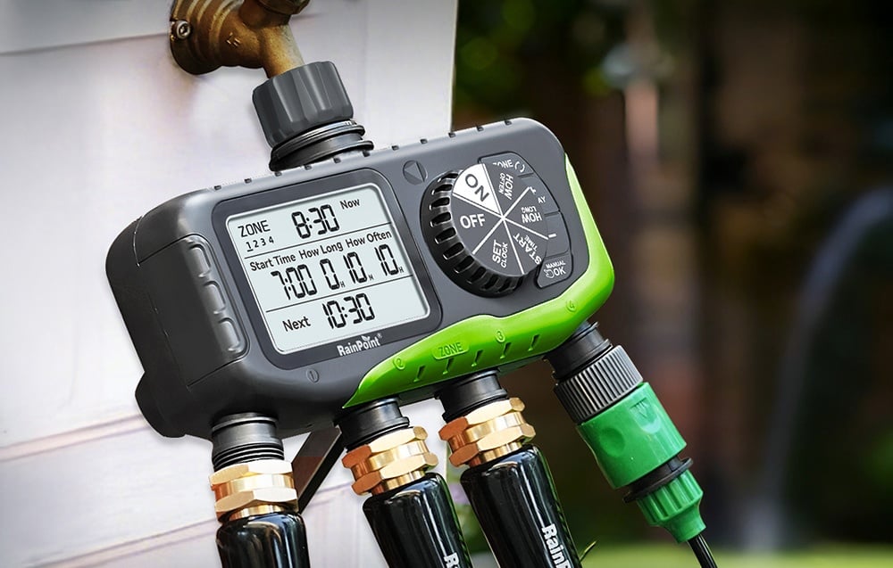 RainPoint 4-zone irrigation controller connected to an outdoor faucet, with 4 hoses connected at the bottom